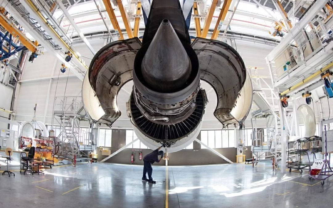 Aircraft engine under maintenance inside an aviation engineering hangar